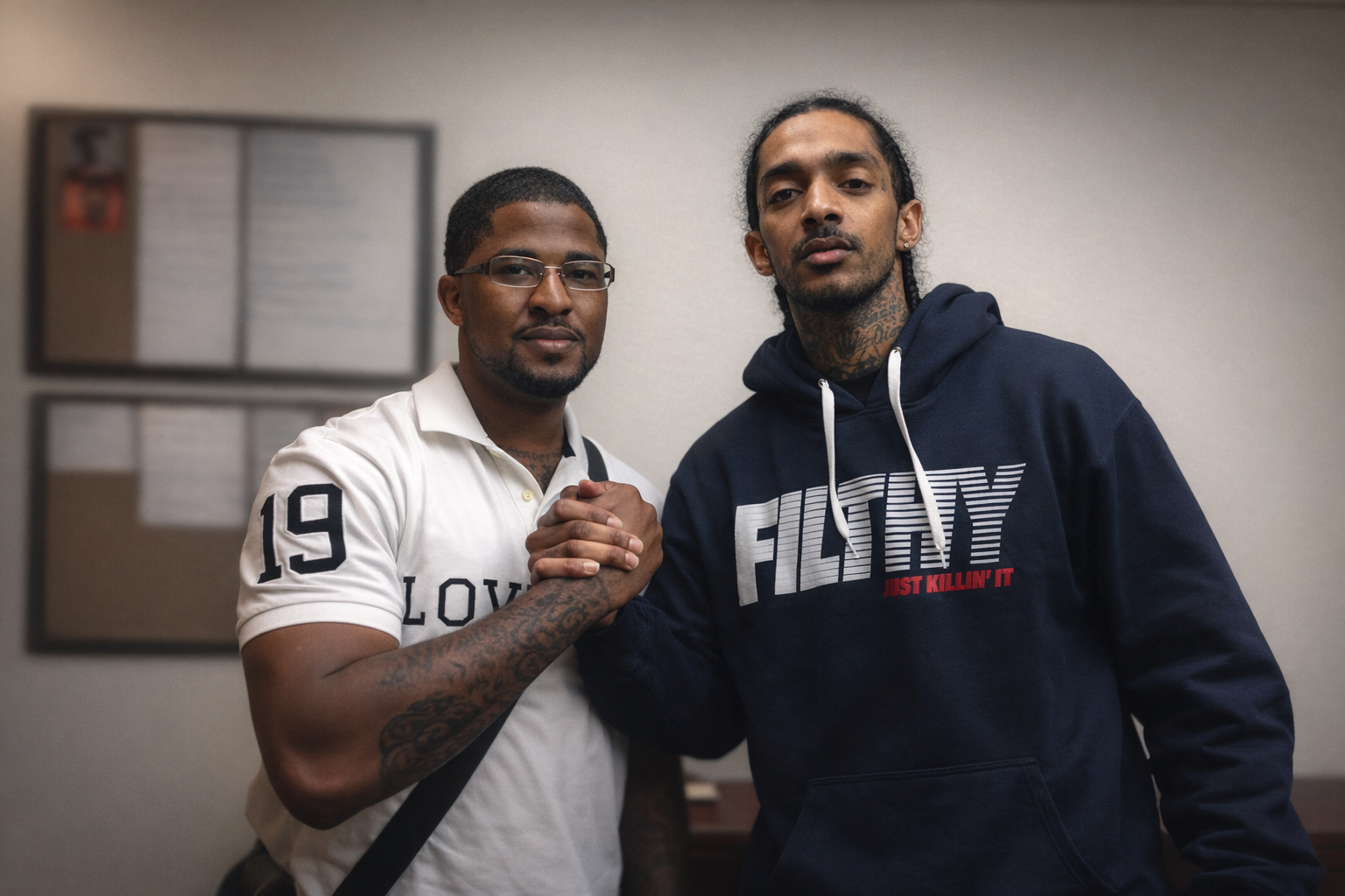 Sherman Perryman standing with Nipsey Hussle